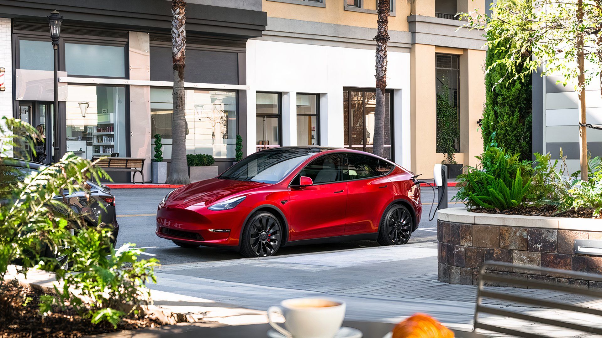 Red Tesla Model Y. Little Electric SUV. 